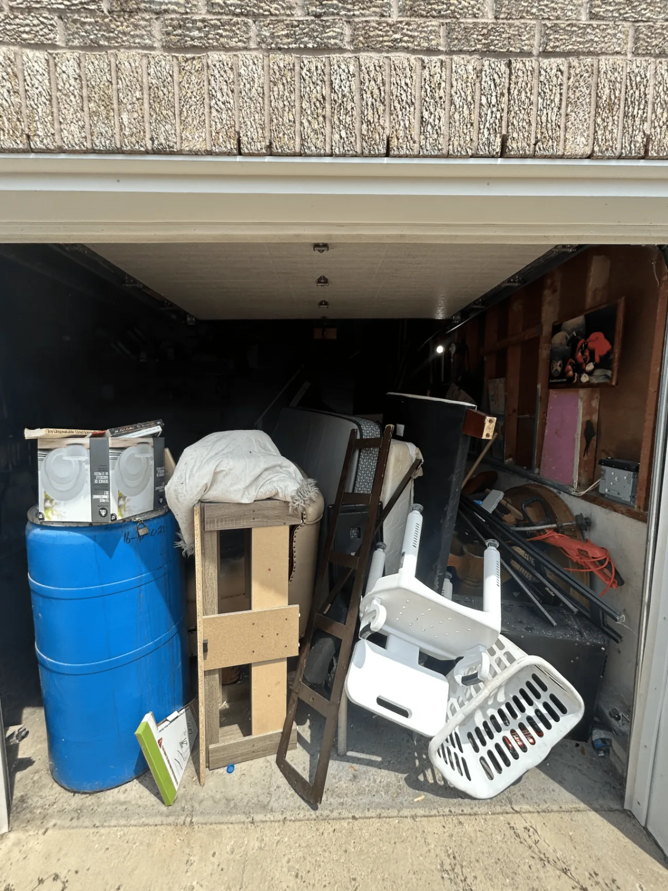 Cluttered garage before pickup