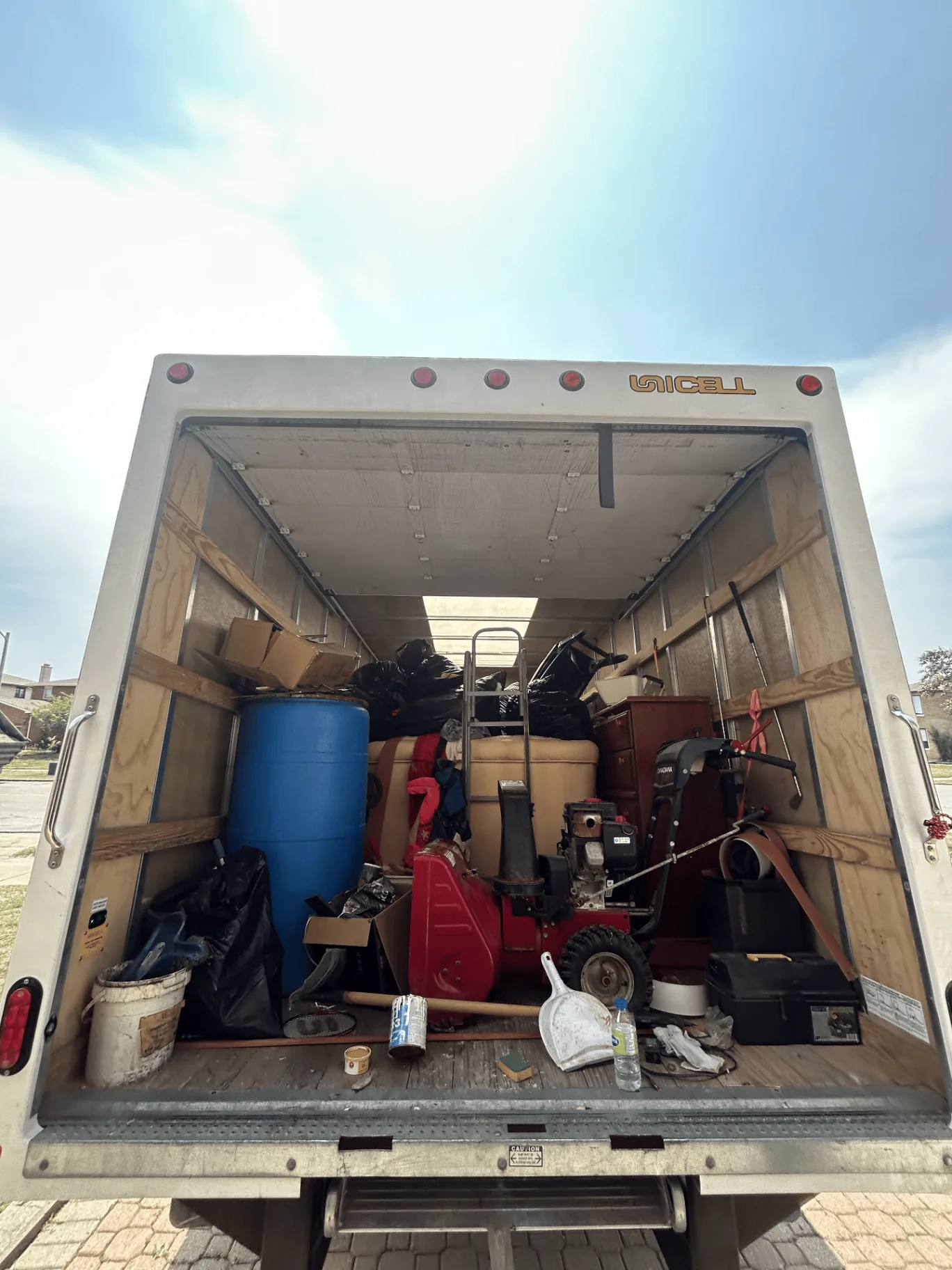 Cube truck loaded with household junk